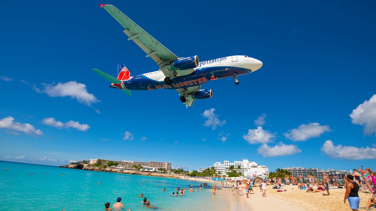 The eerie Caribbean beach where planes fly right above your head – but tourists still call it a tropical paradise